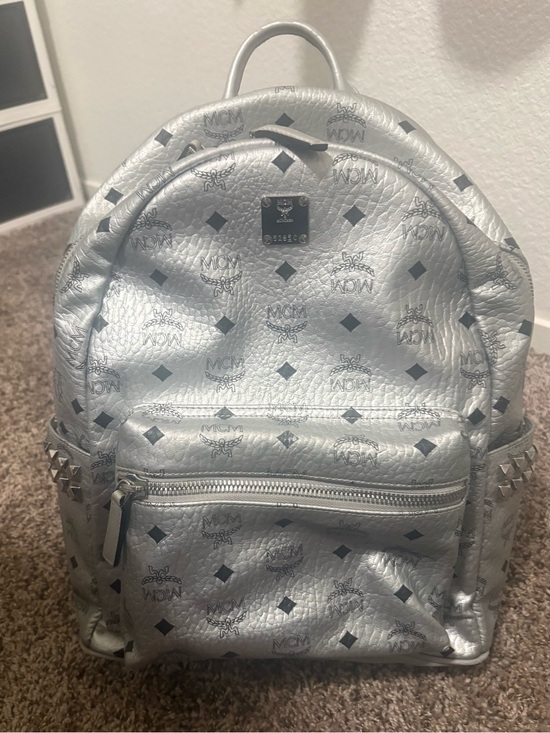 MCM Handbags - MCM Metallic Silver Monogram Backpack with Stud Accents